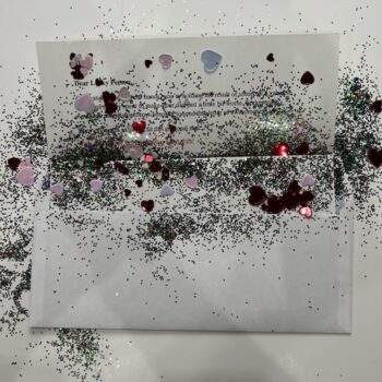 Glitter letter envelope with Heart confetti added.